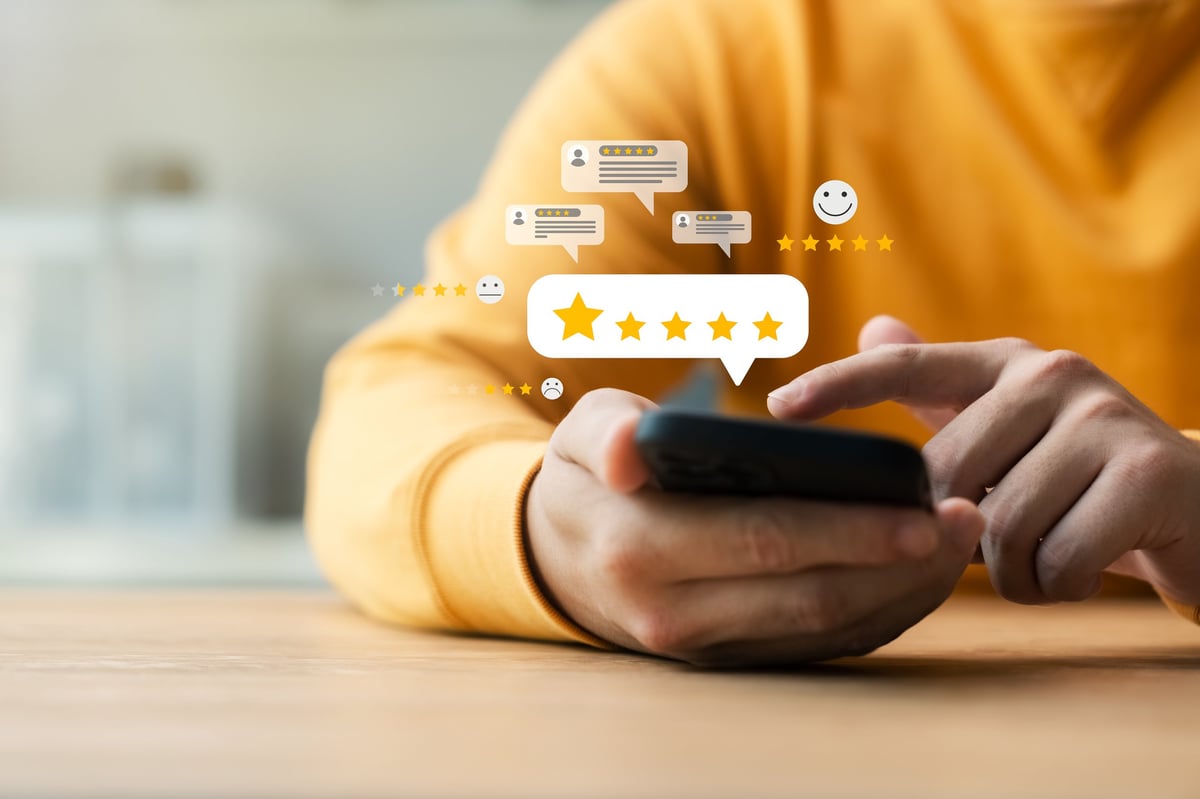 Customer leaving a review on their phone